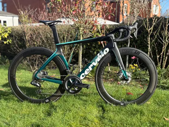 Teal and black Cervélo S5 aero road bike
