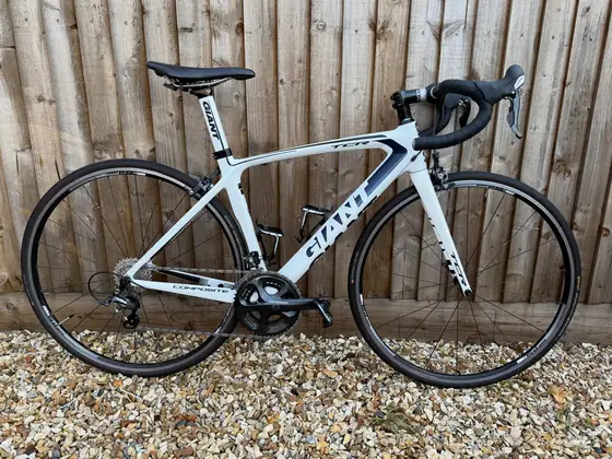 White and black Giant carbon road bike